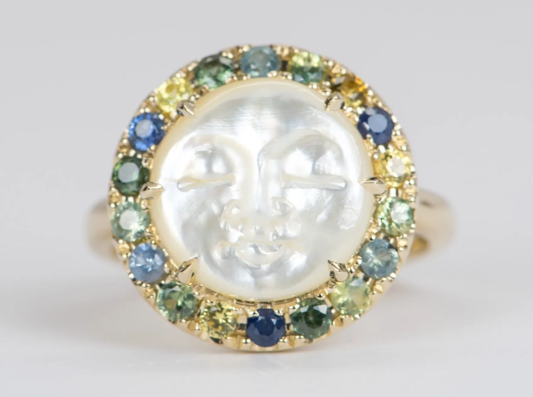 Carved Mother of Pearl Moon Face Disk Ring with Teal Sapphire Gemstone Halo 9K Gold R6367