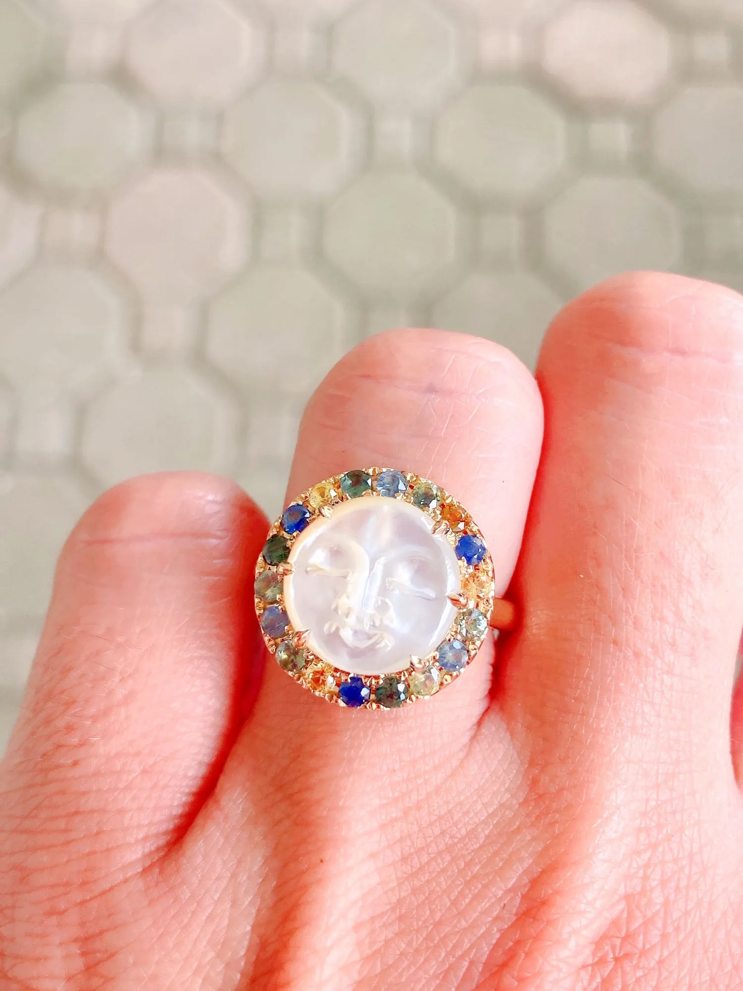 Carved Mother of Pearl Moon Face Disk Ring with Teal Sapphire Gemstone Halo 9K Gold R6367